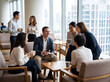 © Amatirta - Business Professionals Networking During Office Event