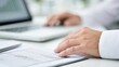 © Generative AI - Close-up on hands working on financial documents and laptop, symbolizing business analysis and accounting
