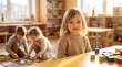 © CuteBee - Young child sitting in bright preschool classroom with peers playing with colorful wooden building blocks in background during sunny afternoon creating warm educational atmosphere