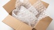 © Fahmi - Open Cardboard Box Filled with Large Bubble Wrap Cushioning for Safe Shipping