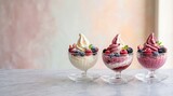 Delicious Assorted Frozen Yogurt Desserts Topped with Fresh Blueberries and Raspberries in Elegant Glass Bowls