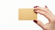 © Adi Stock - Close up studio photograph of a hand with burgundy manicured nails holding a blank gold card
