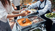 © Marcos - Catering staff serving Mexican food at an event buffet in Mexico Latin America, plate of mexican rice and sauces