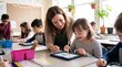 © Lynchsz - Teacher helping a young girl with Down syndrome use a digital tablet stylus in inclusive elementary classroom