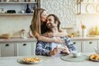 © Prostock-studio - Smiling Caucasian Couple Sharing Affection With Each Other While Enjoying Breakfast Together At Cozy Kitchen Table, Drinking Coffee And Eating Cookies. Weight Loss Concept.