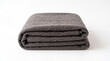 © Faiz - Soft gray folded blanket made from textured fabric, isolated on a white background, representing warmth, comfort, bedding, home textiles, relaxation, and cozy living.