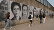 © GOLVR - Diverse People Portraits on City Wall Mural, Street Photography Style Photo