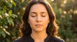 © Saima - Young woman with long dark hair eyes closed at sunset meditation peaceful