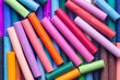 © Christian - Pastels wax crayons, in various bright colours, background backdrop. Art and craft supplies concept