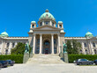 © yalcinsonat - National Assembly of Serbia facade under clear blue sky in Belgrade