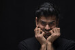 © IndiaPix - Closeup of a stressed young man holding his face stress