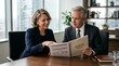 © l1gend - Chief compliance officer walking a new board member through a printed governance orientation packet