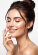 © Ariestia - Beautiful Young Woman with Radiant Skin and Perfect Smile Smiling with Eyes Closed for Beauty and Skincare Concept