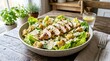 © Vector Vision - Fresh chicken salad in a green bowl on a wooden table with healthy greens and dressing