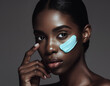 © Camel Studio - Radiant woman with glowing skin and blue cosmetic cream on her face portrait