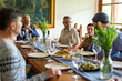 © Rawpixel.com - Casual gathering around dining table