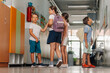 © Ljustina - Elementary students walking school hallway during break time