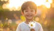 © oke - Joyful young boy holding a white daisy flower in a sun-drenched field at golden hour, gentle smile