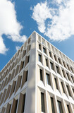 modern office building with blue sky & clouds