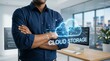 © eren - Businessman standing in modern office with digital cloud storage concept overlay