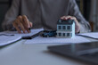 © Supitnan - Close-Up of Agent Explaining Terms of Insurance Policy Contract. Asset Protection and Risk Management Insurance Contract Agreement.
