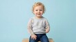 © Saba - Smiling toddler with limb difference and conceptual X-ray skeletal overlay on arms sitting on wooden block