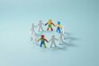 © Creative workshop  - Paper cutouts of people in a circle with puzzle patterns. Represents unity, teamwork, and autism awareness in.