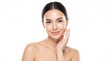 © Purwanto - Portrait of a beautiful young woman with flawless skin, touching her face and smiling gently against a plain white background.