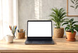 © BestDesginWorld - Modern wooden desk setup with laptop plants and stationery for home office workspace inspiration