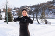 © ADDICTIVE STOCK - Smiling woman in black activewear gives a thumbs up