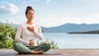 © Alex - Woman practicing a breathing technique for anxiety relief outdoors. Female meditating on a wooden deck with mountain views. Mindfulness and mental wellness concept