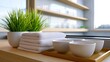 © Matthew - Fresh towels, bowls, and plant on wooden surface, bright modern kitchen interior with shelves