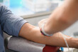 © Serhii - Person donating blood in medical facility for transfusion