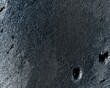 © Ryzhkov - Dark honed slate surface with wet condensation and mineral texture for hospitality product backgrounds or premium food