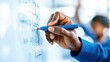 © Art_You - Teacher hands writing math equations on whiteboard with blue marker