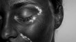 © sknab - Close-up monochrome portrait of serene person with textured skin and unique light patch on face