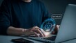 © Nashima Khatun - Person using laptop with AI chatbot icon for online customer support