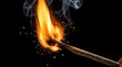 © cutecat - Burning matchstick with flame and sparks against black.