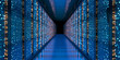 © Hamidakhanom - A long corridor inside a modern data center with glowing blue server racks and digital LED lights