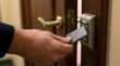 © detiyy - Hand tapping electronic key card on door lock