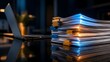 © Ribas_ProductPro - Glowing stack of documents next to a laptop representing digital transformation and electronic data processing in a modern office