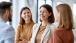 © The Little Hut - Diverse team of professionals collaborating and smiling during a meeting in a modern office environment