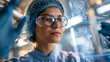 © Julia - Quality-control specialist in a food production facility reviewing an AI inspection result for packaged products, visual interface connecting camera data, detected defect,
