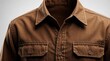 © Pete - Brown cotton work shirt detail showing texture fabric and stitching. Classic button front style with dual chest pockets. Durable casual wear for everyday use.