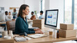 © designbyjuliani - Professional woman monitors digital analytics on her computer screen while working at a tidy wooden desk in a busy modern office setting.