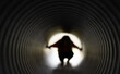 © Volodymyr - Hide and seek starts inside tunnel. Hide concept supports mystery childhood play. Kid uses hide tunnel for adventure. Dark playground creates hide exploration theme.