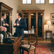 © Muqadas - Stock photo of middle aged man dressing up in big dressing room.