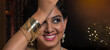 © IndiaPix - Close-up portrait of  young woman posing with bracelet in hand