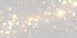 © Strongstock03 - Golden shimmering bokeh lights scattered on a dark background with glowing sparkles on transparent background