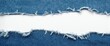 © NFTNexus - Denim Fabric with Torn Edges and White Background in Top View